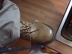 Girl is hurting his cock with a knife and boots