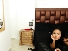 Beautiful Latina milf caressing a big black cock on webcam