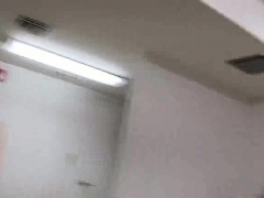 College blonde giving a handjob inside of a bathroom